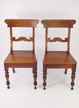 A stylish pair of antique Victorian kitchen chairs or hall chairs.